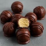 Keto-friendly vanilla protein fat bombs coated in dark chocolate, with a creamy low-carb center — ideal for diabetics and weight loss