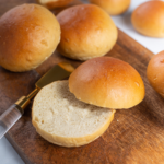 Golden brown keto almond burger buns on a wooden board — soft, low-carb, gluten-free, and diabetic-friendly option for healthy burgers